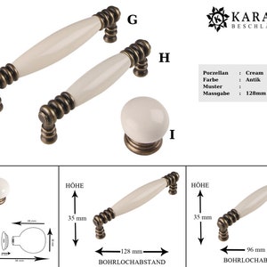 May include: Two antique brass cabinet knobs with cream-colored ceramic handles. The knobs are 128mm x 96mm and have a 35mm height. The knobs are labeled "G", "H", and "I".