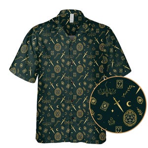 May include: Dark green button-down shirt with a repeating gold pattern of swords, moons, stars, and geometric shapes. The short-sleeved shirt has a classic collar and a button-up front. A circular inset shows a close-up of the pattern.