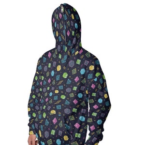 May include: A dark blue zippered hoodie with a colorful pattern of dice and lightning bolts.