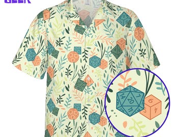 May include: A short-sleeved button-down shirt with a cream background, featuring a pattern of dice and foliage in shades of green, orange, and blue. The shirt has a classic collar and the text "OWLMINND GEEK" in purple.