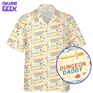 May include: A short-sleeved shirt with a cream background featuring a repeating pattern of swords, gems, and the text "DUNGEON DADDY" in red and blue. The shirt has a classic collar and a relaxed fit. The OwlMind Geek logo is in the upper left corner.