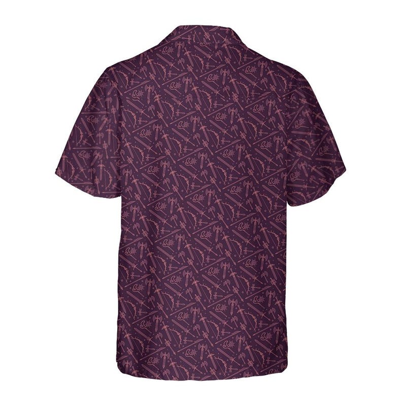 May include: A short-sleeved button-down shirt in a deep purple hue, featuring a repeating pattern of stylized weapons such as swords, axes, and bows. The shirt has a classic collar and a relaxed fit, suitable for casual wear.