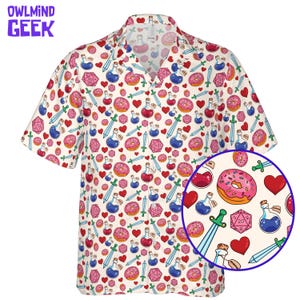 May include: Cream-coloured button-up shirt featuring a repeating pattern of donuts, hearts, potion bottles, dice, and swords. The shirt has short sleeves and a collar. The text "OWL MIND GEEK" is in the upper left corner.