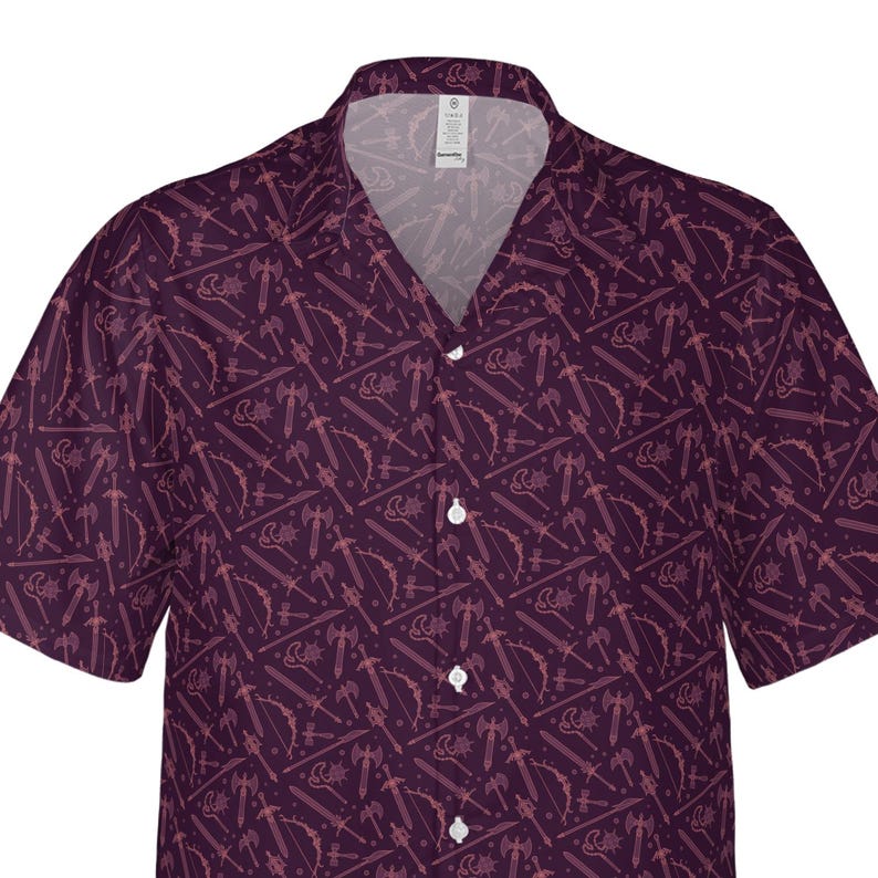 May include: A short-sleeved button-down shirt in a deep purple hue, patterned with light pink weapon illustrations. The design includes swords, axes, bows, and other fantasy-themed elements. The shirt has a classic collar and white buttons.
