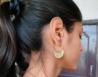 Hammered hoop earrings.