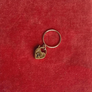 May include: A rustic wooden sign with the text "Welcome to our home" in white lettering. The sign features a distressed finish and a simple, inviting design, perfect for entryway decor.