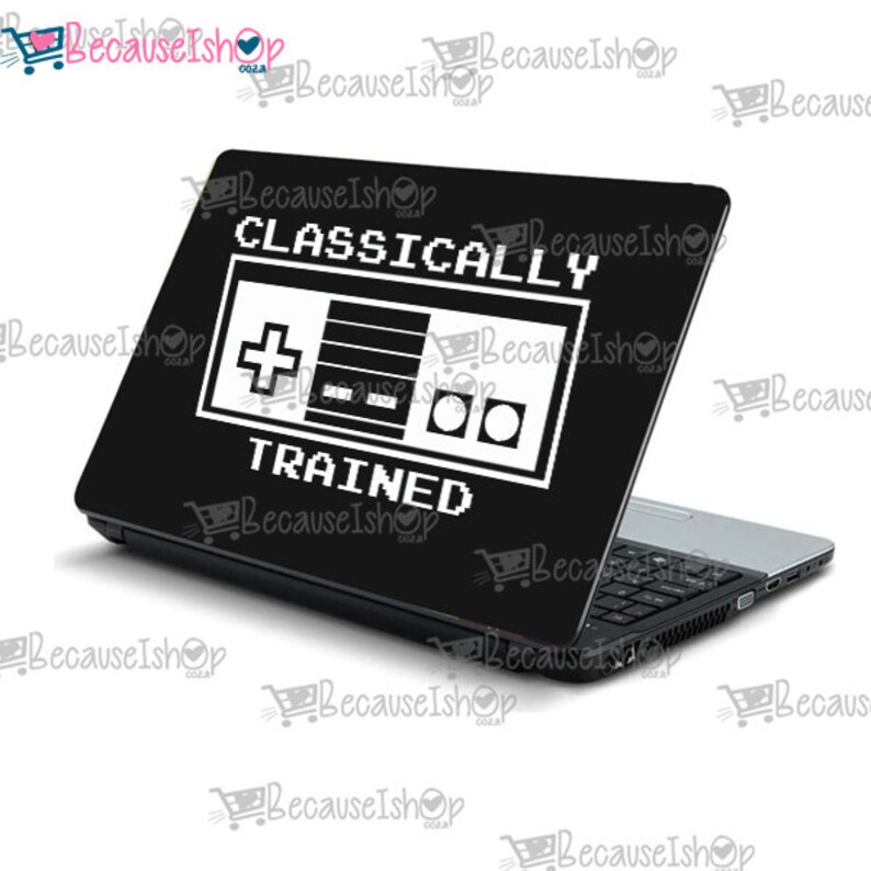 May include: A black laptop with a white sticker that says "CLASSICALLY TRAINED" with a pixelated image of a video game controller.