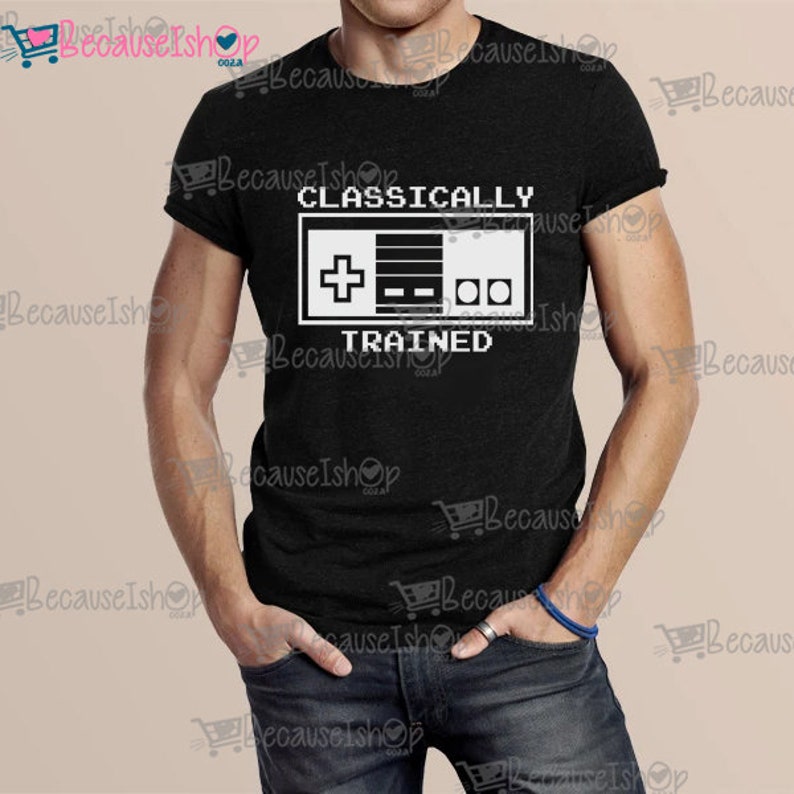 May include: A black t-shirt with a white graphic of a video game controller and the text "CLASSICALLY TRAINED".