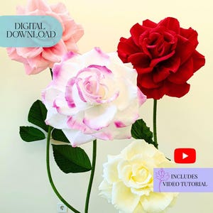 Pode incluir: Quatro grandes rosas de papel em tons de rosa, branco e vermelho, com caules e folhas verdes. Uma rosa é branca com bordas rosa, outra é vermelho escuro e uma terceira é rosa pálido. A imagem inclui o texto "DOWNLOAD DIGITAL" e "INCLUI TUTORIAL EM VÍDEO".