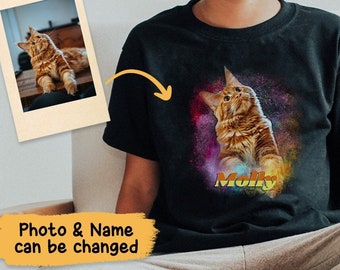 May include: A black t-shirt with a colorful galaxy background featuring a cat with the name "Molly" printed on the front.