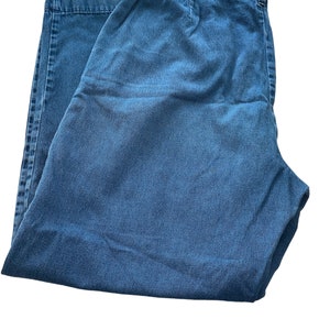 May include: A pair of blue denim pants with an elastic waistband.