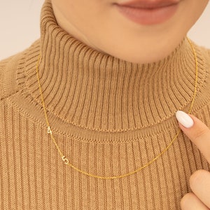 Elegant jewelry pouch with a delicate ribbon, enclosing a Personalized Number Necklace, ready for gifting. Tasteful unboxing experience.