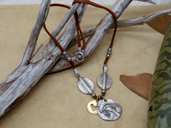 Brown leather, gold silver and pewter charm necklace