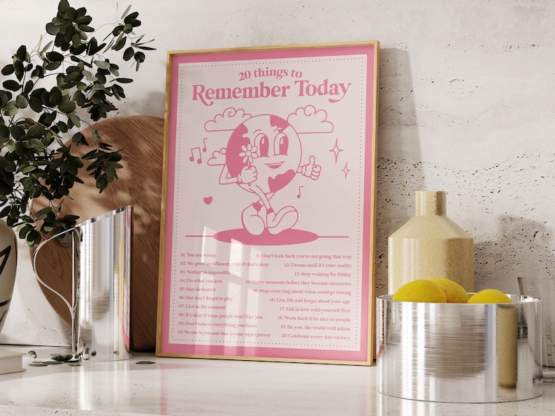 May include: A pink and white poster with a cartoon character holding a flower. The poster says "20 things to Remember Today" and lists 20 affirmations.