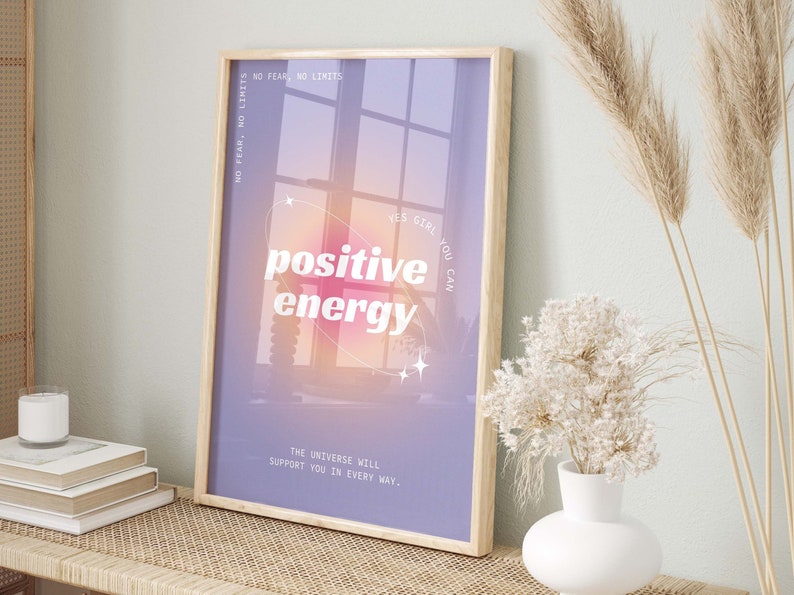 May include: A motivational poster with a purple background and a window with a pink and orange gradient. The text on the poster reads "NO FEAR, NO LIMITS", "YES GIRL YOU CAN", "positive energy", and "THE UNIVERSE WILL SUPPORT YOU IN EVERY WAY."
