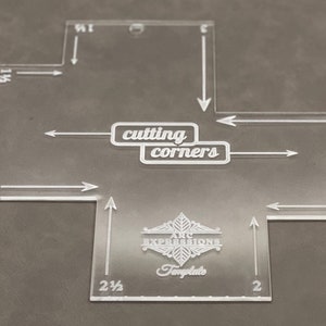 May include: A clear plastic template for cutting corners, with measurements in inches. The template is labeled "cutting corners" and "Arc Expressions Template".