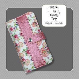 May include: A pink and white floral patterned wallet with a pink leather flap and snap closure. The wallet has the text "Stitches by Christy Ivy Acrylic Templates" on it.