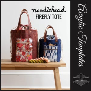 May include: Two brown leather tote bags with drawstring closures. The larger bag has a floral print pocket and the smaller bag has a geometric print pocket. Both bags are sitting on a wooden table. The text "noodlehead FIREFLY TOTE" is at the top of the image. The text "Acrylic Templates" is on the right side of the image.