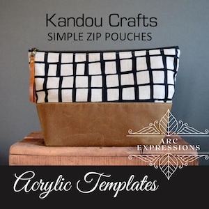 May include: A black and white geometric fabric pouch with a brown leather bottom. The pouch is labeled "KANDOU CRAFTS SIMPLE ZIP POUCHES" and "Acrylic Templates".
