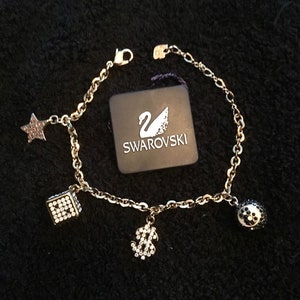 Swarovski charm bracelet price hot sale