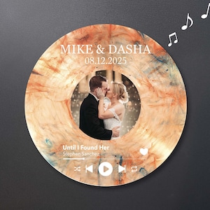 May include: A circular wedding keepsake with a photo of a kissing couple at its centre. The design includes the names "Mike & Dasha" and the date "08.12.2025". The song title "Until I Found Her" is also displayed.