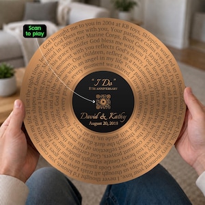 May include: A circular copper-toned plaque featuring a central black disc with the text "I Do" 8th Anniversary, David & Kathy, August 20, 2018, and a QR code. The surrounding copper area contains a long personal message and a "Scan to play" label.