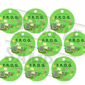 May include: A set of green circular tags with a frog theme. Each tag features a frog illustration on a lily pad, with the text "Fully Rely On God" and "F.R.O.G." in a playful font. The background is light green.