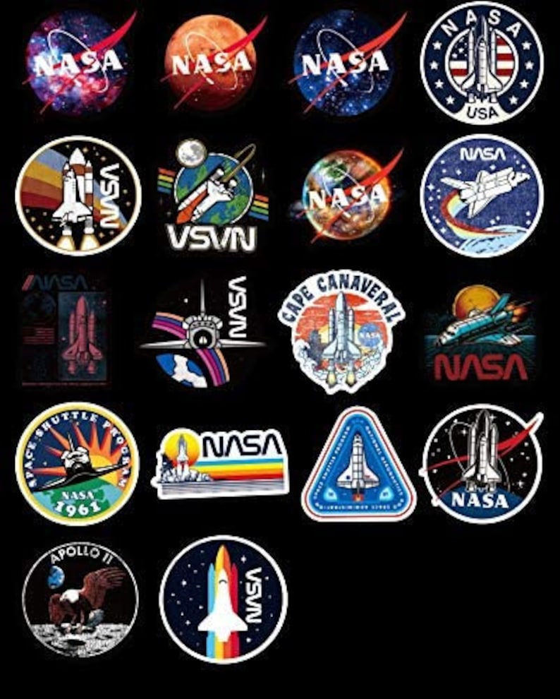 May include: A selection of NASA-themed stickers with diverse designs. The stickers display the NASA logo, space shuttles, planets, and the American flag. The stickers are in various shapes, including circles and triangles.