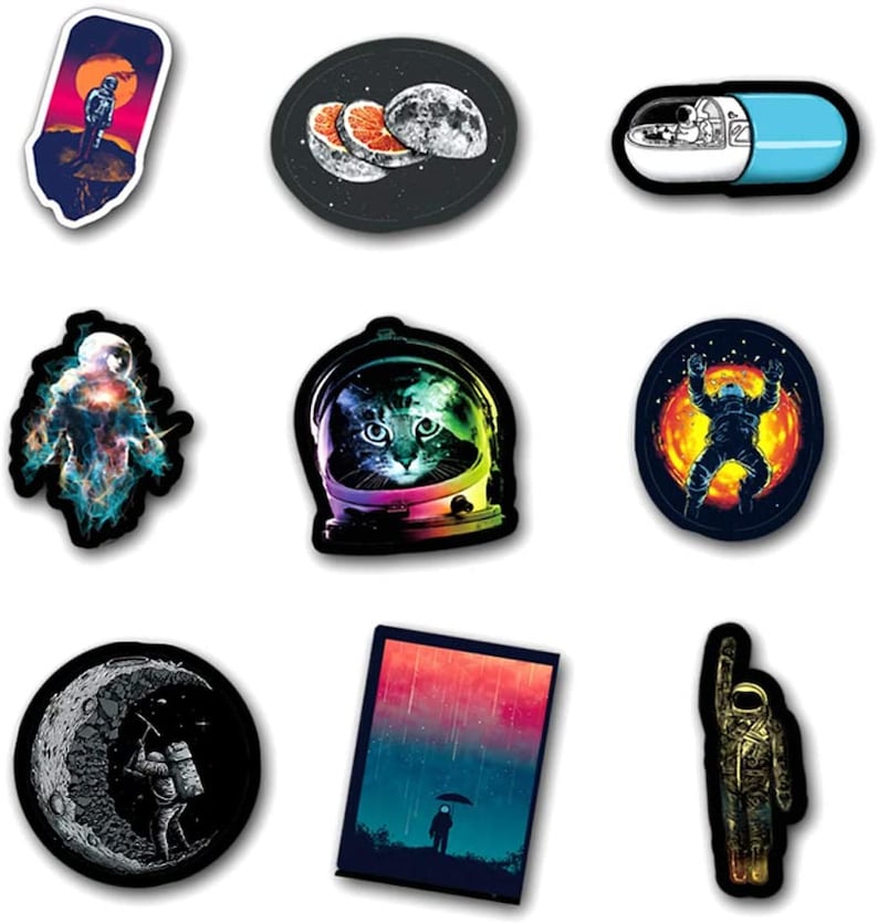 May include: A selection of vibrant stickers with space-themed illustrations. Designs include an astronaut on a planet, a cat in a space helmet, and a pill with an astronaut inside. Each sticker has a white border.