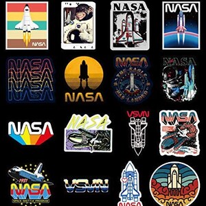 May include: A selection of NASA-themed stickers with diverse designs. The stickers display rockets, space shuttles, and the NASA logo in various styles and colours, including retro and modern designs. Some stickers include text like "SPACE SHUTDLE PROGRAM" and "VSVN".