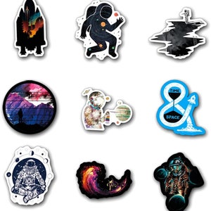 May include: A set of nine space-themed stickers. Designs include an astronaut, a rocket, a galaxy, and the words "TIME & SPACE". The stickers feature a variety of colours, including black, blue, orange, and purple.