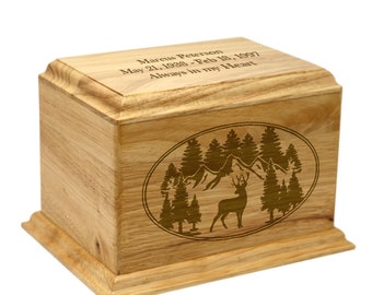 May include: A rectangular wooden cremation urn featuring a natural light brown wood grain. The top lid is engraved with the text Marcus Peterson, May 21, 1938 - Feb 18, 1997, Always in my Heart. The front panel displays an oval laser-etched forest scene.