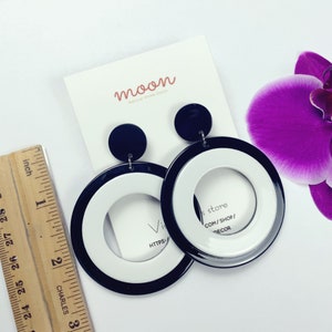 Moon’s black and white circle acrylic stud earrings