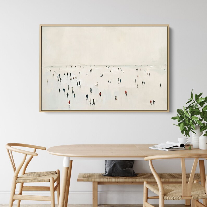 May include: A minimalist painting of a crowd of people in muted colors walking on a white surface. The painting is framed in a light wood frame.