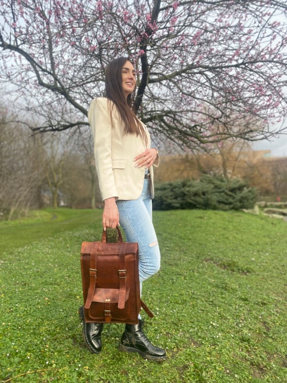 Leather top rolling backpack