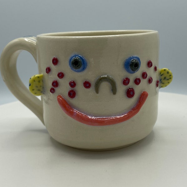 Hand made ceramic face mug