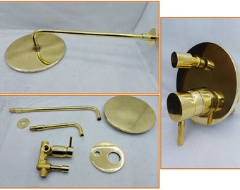 May include: Gold shower head set with a round shower head, a handheld shower head, and a diverter valve. The shower head is attached to a long, curved arm.