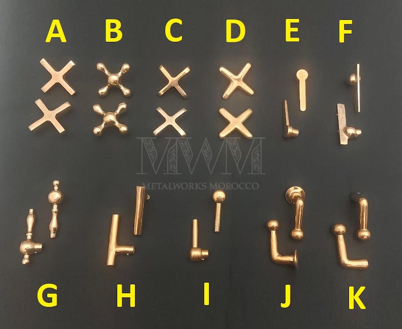 May include: Assortment of gold-toned metal cabinet hardware, including drawer pulls, knobs, and handles. The hardware is labeled with letters A through K.