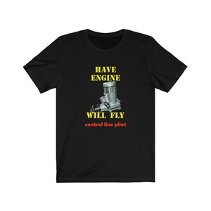 May include: Black t-shirt with a yellow graphic that says "HAVE ENGINE WILL FLY" and "control line pilot". The graphic also features a small model airplane engine.