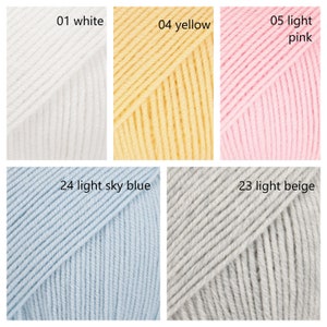 May include: A collection of yarn skeins in various colors, including white, yellow, light pink, light sky blue, and light beige. The yarn is arranged in a grid pattern, with each skein labeled with a number and color name.