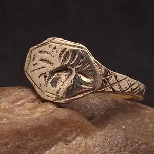 Huge massive medieval bronze ring with ornaments and pseudo-heraldic design on the shield. Rare Original medieval ring. Size US 14