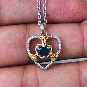 Enchanted Disney Fine Jewelry 925 Silver and Yellow Gold Plated with 1/10 CTTW Diamond and Heart Blue Topaz Merida Heart Pendant - Necklace