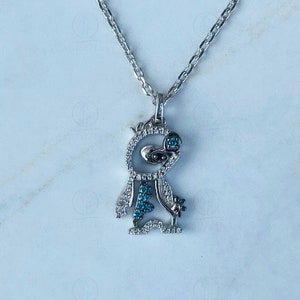 Disney Treasures Lilo & Stitch Blue Topaz and 1/8 CTTw Black Round CZ Diamond Pendant Sterling Silver And Black Rhodium Plated Necklace 18&quot;