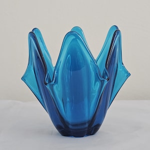 May include: A set of three ceramic mugs with a speckled, matte finish. The mugs are in shades of cream, light gray, and dark gray. Each mug has a simple, minimalist design, perfect for coffee or tea.