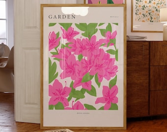 May include: Three framed botanical prints with the word "GARDEN" in the title. The prints feature pink flowers, pink and purple flowers, and white flowers. The print on the left features pink flowers with green leaves and the text "ROYAL AZALEA".