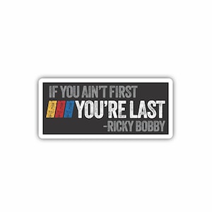 May include: Black and white sticker with the text "If you ain't first you're last - Ricky Bobby". The text is in a distressed font and there are three colored stripes behind the text.