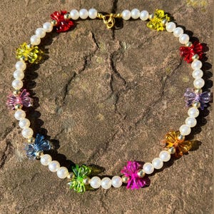 Pearl necklace; pretty pearl necklace; bow necklace; pink bow face necklace; rainbow bead necklace; rainbow necklace; y2k necklace;