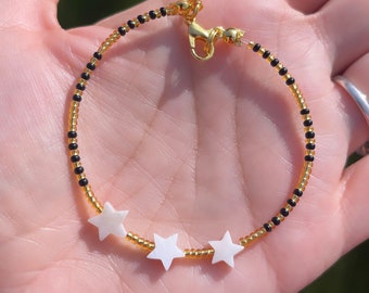 Mother of pearl star bracelet; mother of pearl bracelet; 3 star bracelet; black beaded bracelet; star bracelet; stacking bracelet; star bead
