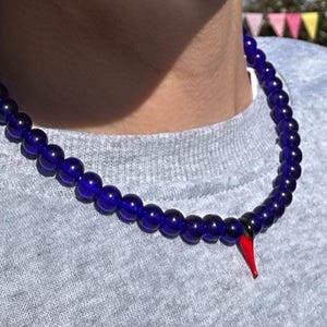 Chilli necklace; blue necklace; blue beaded necklace; chilli and blue necklace; glass chilli bead necklace; chilli bead necklace; chilli bea