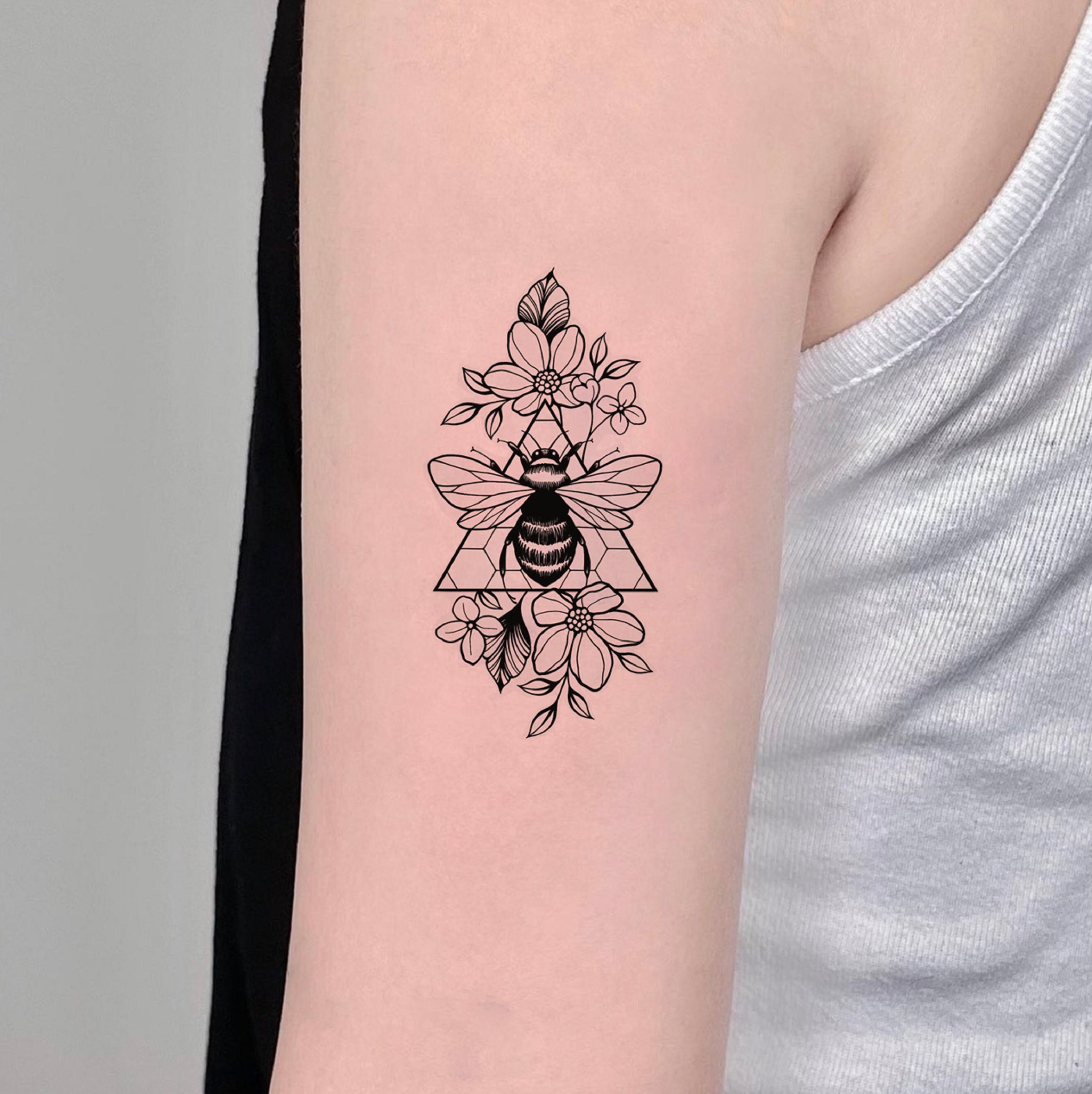 My recently acquired Tattoo featuring a swarm of bees native to Australia  making their way to a bouquet of native Australian flowers  rbees